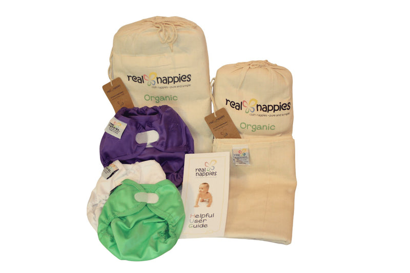3 Snug Wrap nappy covers of different sizes with 2 packs of 6 prefolds of different sizes.